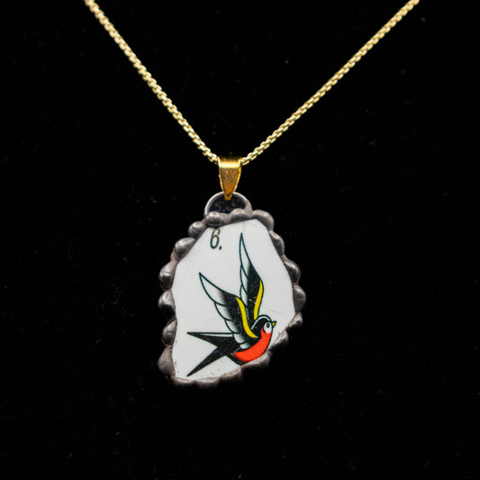 Bird Necklace.  (Black Trim with Gold Colored Chain).